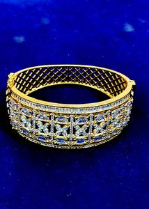 Elegant Gold Bangle with White Stones