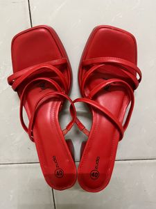 Unused red heels