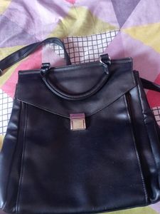 black handbag cum backpack style bag.