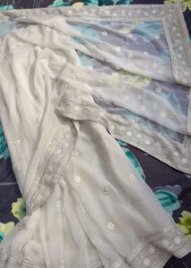Elegant White Saree with Silver Embellishments
