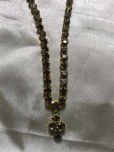 Elegant Gold Chain with Dark Stones