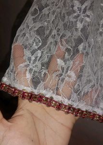 Elegant White Lace Gown with Red Trim