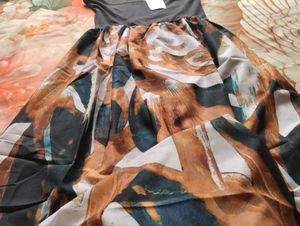 Chic Halter Neck Maxi Dress with Abstract Print