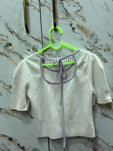 Chic Textured Knit Top with Bow Detail