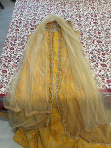 Ethnic yellow gown with shrug and dupatta