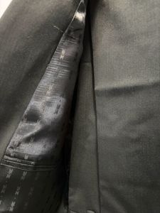 A Raymond Suit of rich dark greenish black colour