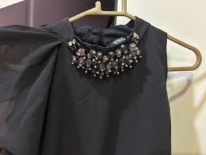 Chic Black Dress with Embellished Neckline