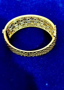 Elegant Gold Bangle with White Stones