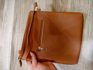 Tan crossbody bag with flower detail