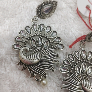 Silver lookalike peacock earing