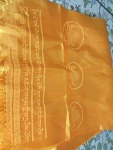 Traditional yellow Tibetan khata scarf