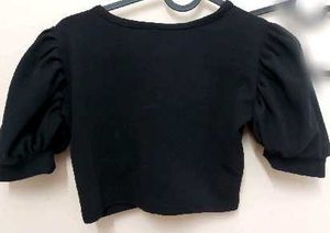 black crop top with bell sleeves
