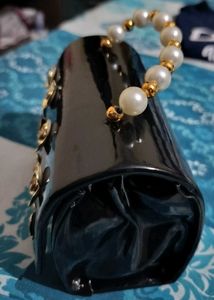 Elegant Black Clutch with Gold Flower Embellishmen