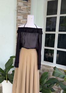 Off-Shoulder Ruffle Black Top with camel skir