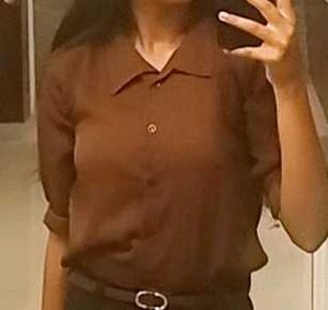 brown shirt with black buttons