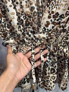Chic Leopard Print Peplum Blouse – V-Neck Long Sle