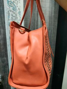Chic Orange Laser-Cut Handbag