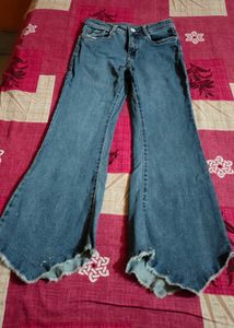 Distressed and flared Blue Denim Jeans