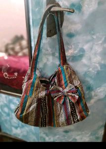 Boho Chic Striped Handbag with Bow Detail