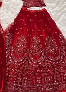 Stunning Red Embellished Lehenga Choli