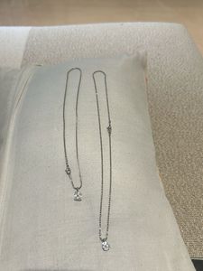 Two dainty diamond necklaces