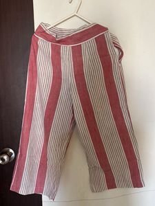 white sleeveless kurta with pink stripped pants
