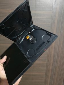 PS2 Console With 11 CD's (Non Working)
