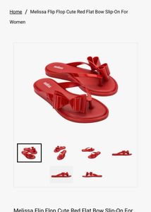Melissa Orange Flip Flops with Bow Accent