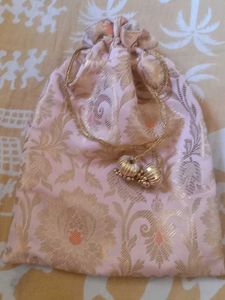 Golden Brocade Potli Bag with Tassel Drawstring –