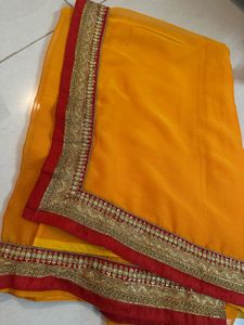 Vibrant Orange Saree with Brocade Blouse