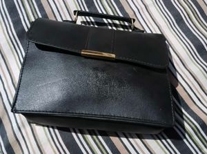 Chic Black Handbag with Charm