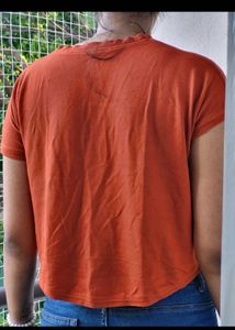 Edgy Orange Graphic Crop Top