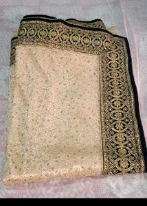 Elegant Cream Saree with Gold Embellishments