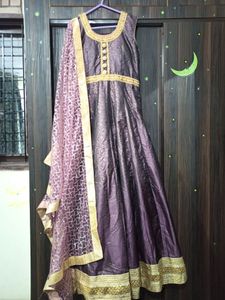 beautiful purple color heavy gown with bottom and dupatta