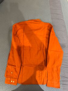 orange shirt from snitch