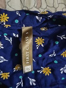 Its Navy Blue Top With White And Yellow Flowers