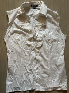Elegant White Sleeveless Ruffle Blouse