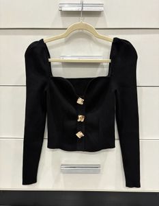 Chic Black Top with gold buttons