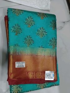 Beautiful Teal Saree with Gold Border