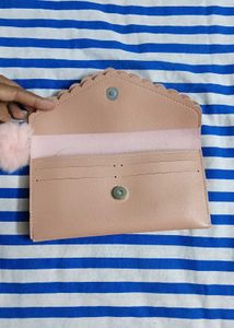Chic Pink Studded Clutch with Pom Po