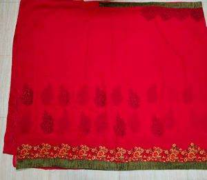 Rani Pink Embroidered Saree with stitched blouse