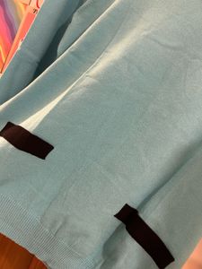Aqua Blue Knit Top with Black Accents