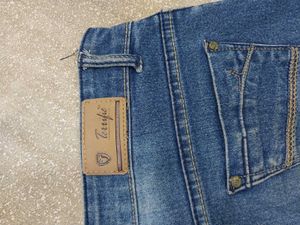 Distressed Blue Denim Jeans