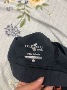 Black Sports Bra with 'RELIVE' Graphic