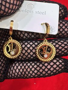 Gold Tone Hoop Earrings with Crystal Accent