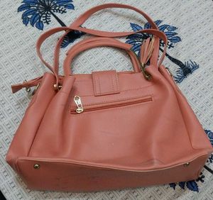 Stylish Peach Handbag with Embellishments