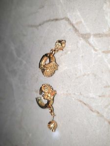 Gold Dangle Earrings with Intricate Design