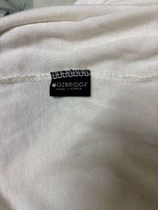 OZBRIDGE SHEER TURTLE NECK TOP