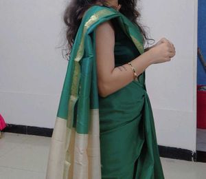 Elegant Teal Green Saree with Gold Border