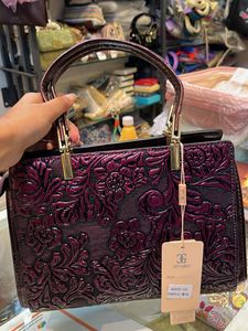 Elegant Embossed Purple Handbag